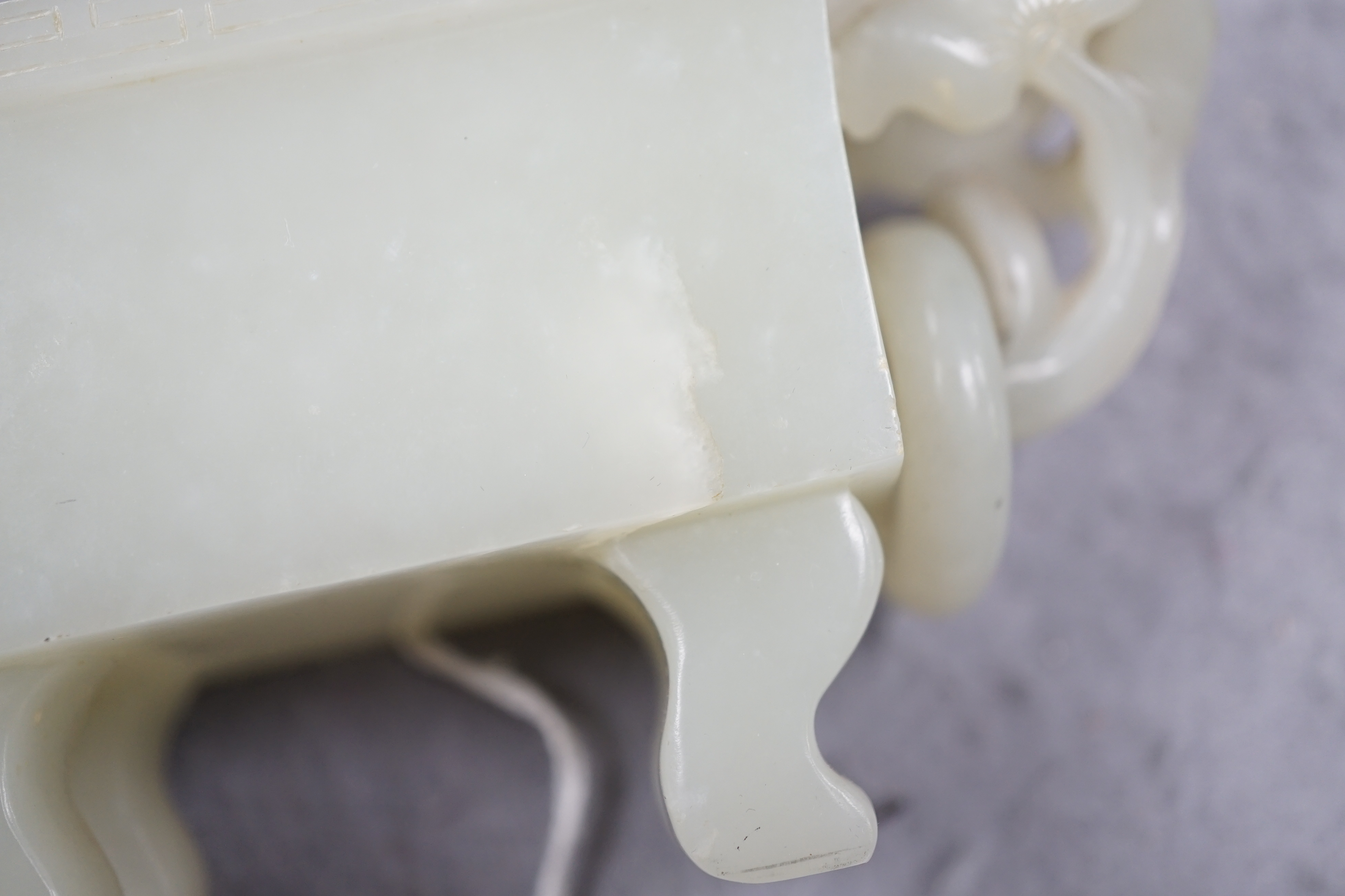 A Chinese pale celadon jade rectangular vase and cover, 19th/20th century